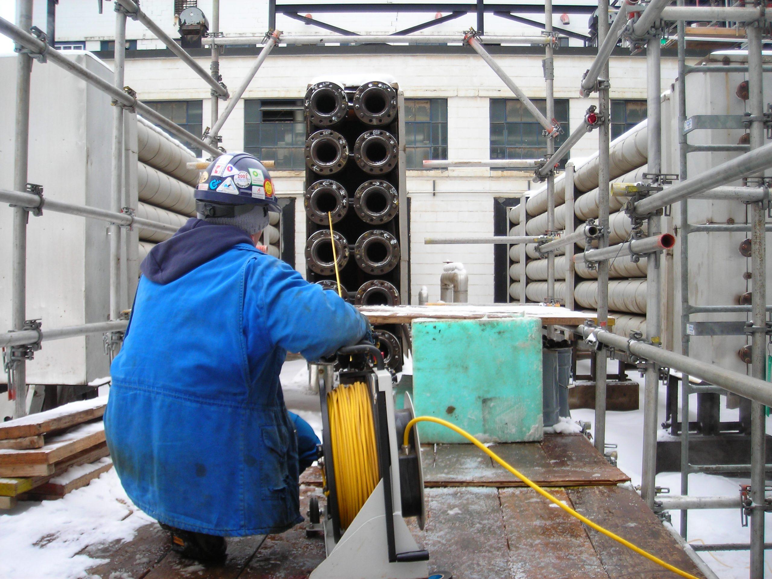 Technician completing a push reel inspection.